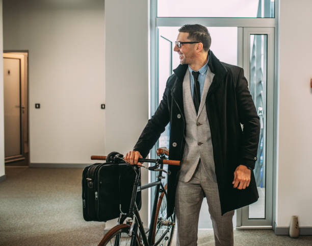 istock Businessman with a bycicle in office 1442743709