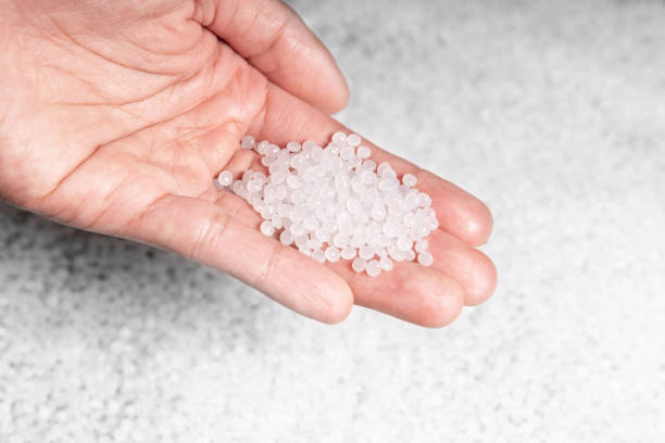 istock engineer hold white plastic on hand polymer petrochemical product as polymer raw material for plastic in polymer chemical industry design and test in polymer science laboratory 1442746298