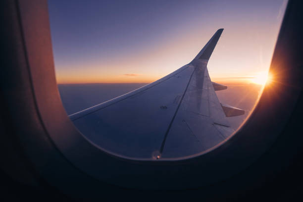 istock View from airplane window over wing during beautiful sunset 1442748523
