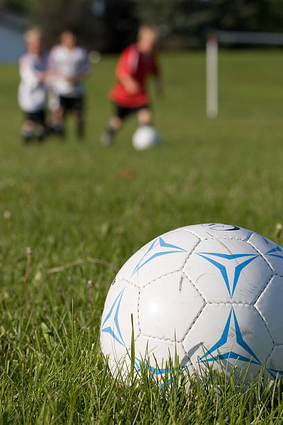 istock Soccer ball and players 144275139