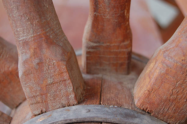 istock Old wagon wheel spokes and hub 144275142