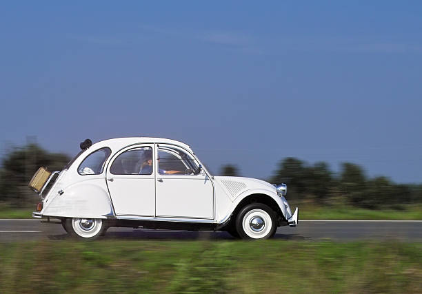 istock Old french car in motion 144275279