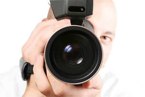 istock Cameraman with Camcorder recording 144275671