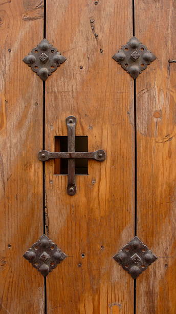 istock Iron cross on door 144275763