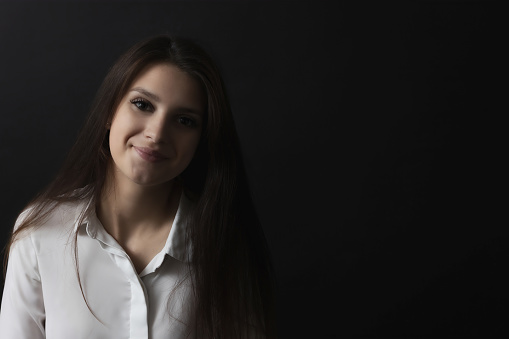 Front view portrait of smiling beautiful girl. Horizontally.