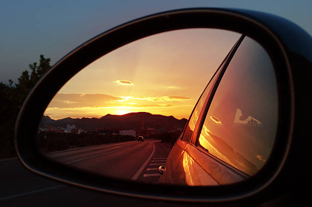 istock Reflection of sunset in car mirror 144276278