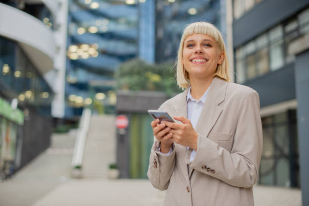 istock Happy young woman using phone 1442763641