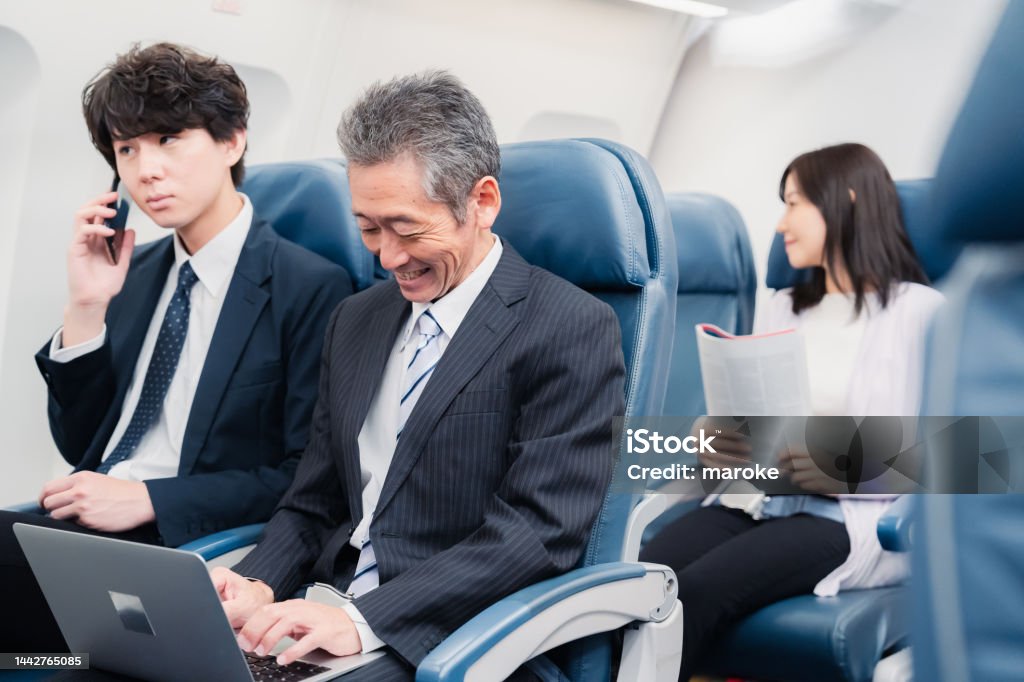 Businessman traveling on a Shinkansen Shinkansen Stock Photo
