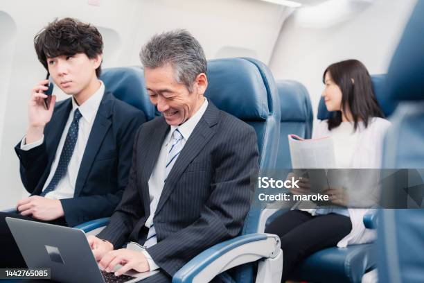 Businessman Traveling On A Shinkansen Stock Photo - Download Image Now - Shinkansen, Seat, Vehicle Seat