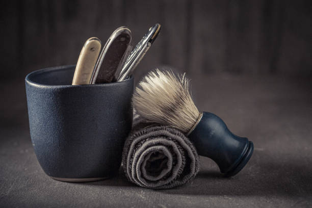 Professional hairbrush rests on a clean, organized barbershop workstation, surrounded by essential hairdressing tools. The image highlights the precision and care involved in the beauty and grooming process, showcasing a moment of calm in the busy salon environment. The concept hairdressing beauty.