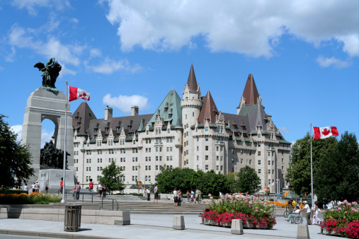 On the left hand side is the arch shaped Cenotaph with remains of the Unknown Soldier.  The historic Chateau Laurier hotel is in the background.