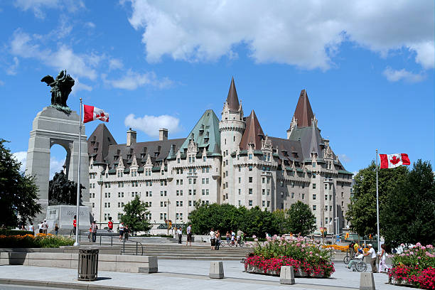 Ottawa, World War I Memorial Cenotaph On the left hand side is the arch shaped Cenotaph with remains of the Unknown Soldier.  The historic Chateau Laurier hotel is in the background. chateau laurier stock pictures, royalty-free photos & images