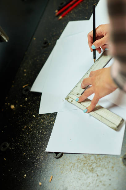 istock Female interior designer working on drawings, woman architect draws 1442767174