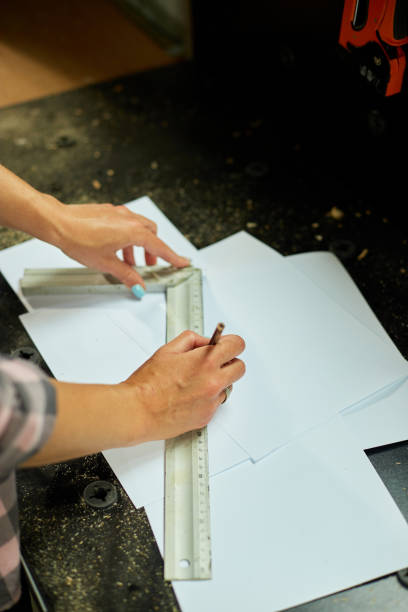 istock Female interior designer working on drawings, woman architect draws 1442767177
