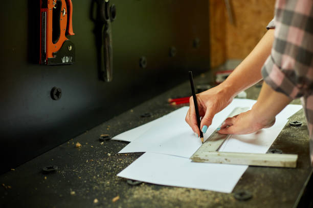 istock Female interior designer working on drawings, woman architect draws 1442767195