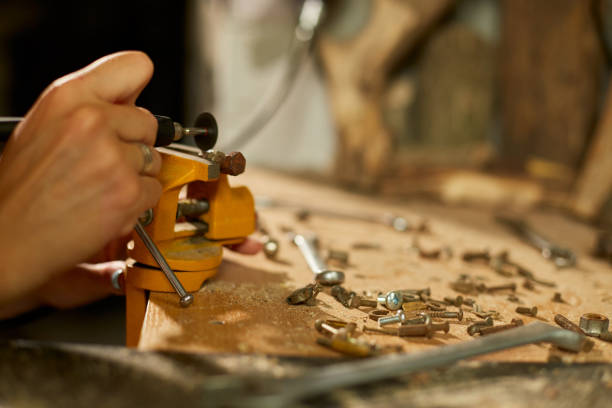 istock Woman using power working grinder machine, female hand grinds a metal nuts 1442767255