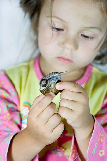 istock Girl and snail 144276857