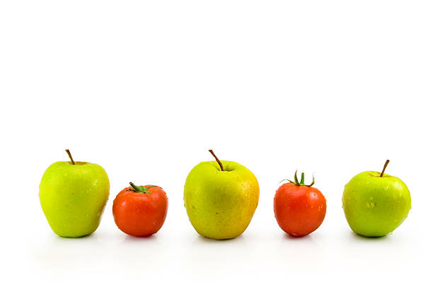 Pommes vertes et rouges tomates - Photo