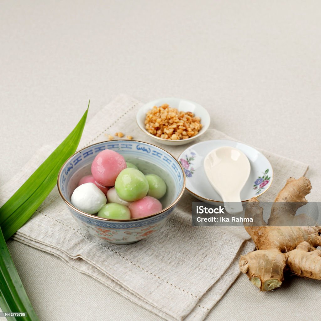 Wedang Ronde or Tangyuan, Glutinous Sweet Balls, Served in Ginger Syrup and Tossed with Roasted Peanuts. Wedang Ronde or Tangyuan, Glutinous Sweet Balls, Served in Ginger Syrup and Tossed with Roasted Peanuts. Copy Space for Text Afternoon Tea Stock Photo