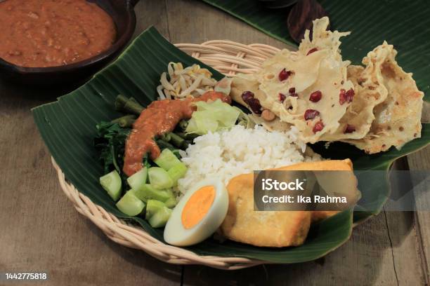 Nasi Pecel Madiun Indonesia Food Rice And Vegetables With Peanut Sauce Stock Photo - Download Image Now