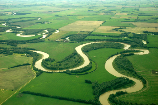 A top view of a curved river in northern alberta, canada.