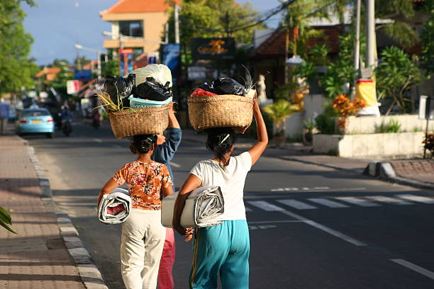 Balinese women carrying their things, Nusa Dua, Bali, Indonesia. stock photo