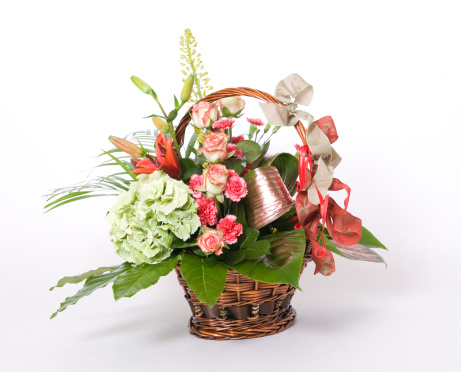 Basket full of variety colorful flowers 