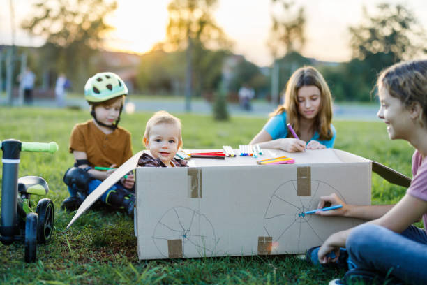 istock Playful kids having fun in the park 1442780055