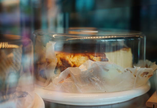 Cheesecake in a plat served for eating and  cover with glass