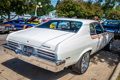 Des Moines, IA - July 03, 2022: High perspective rear corner view of a 1973 Pontiac Ventura Hardtop Coupe at a local car show.