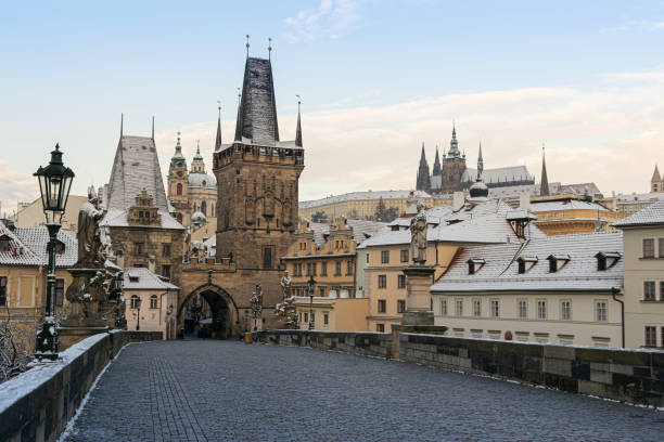 istock First snow in Prague, Charles bridge and Prague castle 1442781914
