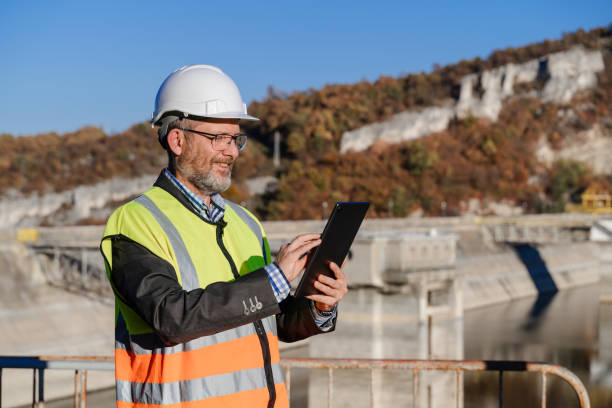 istock Male engineer working with a digital tablet in hydroelectric dam 1442783422