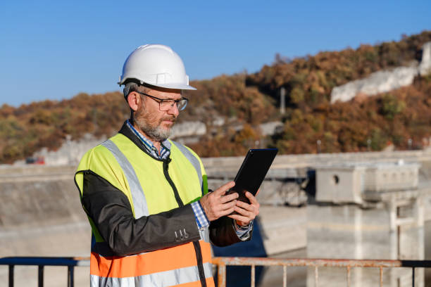 istock Male engineer working with a digital tablet in hydroelectric dam 1442783432