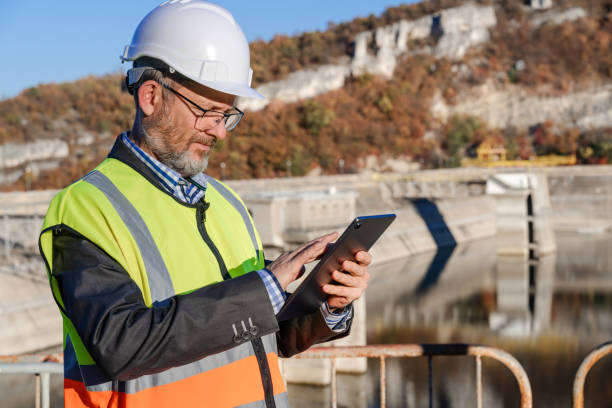 istock Male engineer working with a digital tablet in hydroelectric dam 1442783438