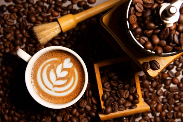 istock Flat lay a white cup coffee with a coffee bean grinder. 1442783776