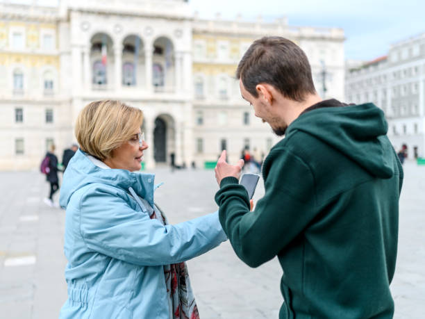 Worried tourist asking for help to a boy on the street