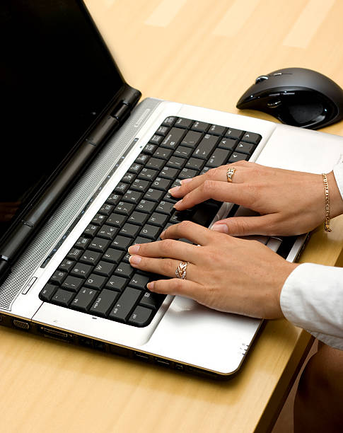 Woman working on laptop. stock photo