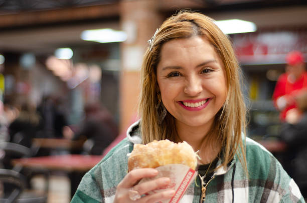 istock Woman eating hamburger with copy space 1442784982