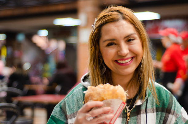 istock Woman eating hamburger with copy space 1442784983