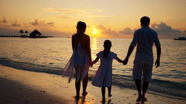 istock Family With Child Together On Beach 1442785162