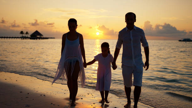 istock Family With Child Together On Beach 1442785164
