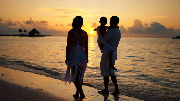 istock Family With Child Together On Beach 1442785167