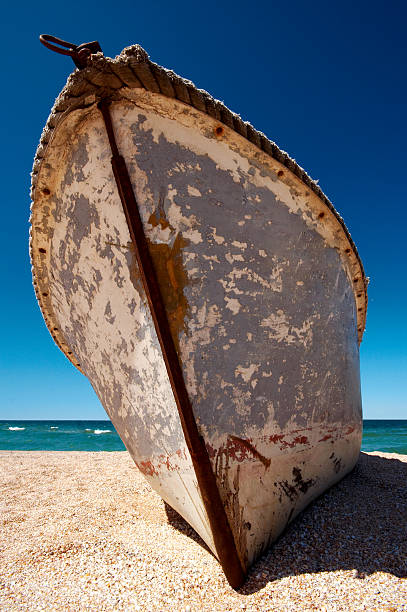 istock Old lonely boat abandoned at seacoast 144278757