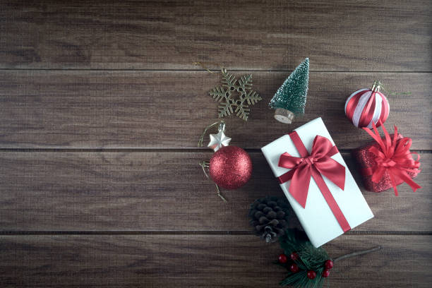 istock Christmas holiday composition, beautiful Xmas black board framed decoration items and gift box, calibration winter holiday wooden background with festive decorative elements and copy space for text 1442788389