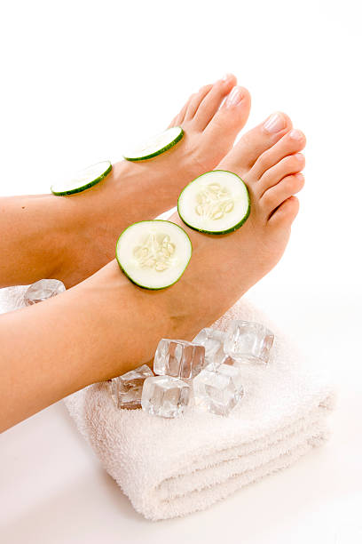 istock feet of lady relaxing in spa over white 144278882