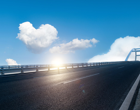 Heart shaped cloud over modern bridge