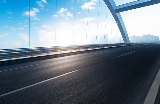 Long exposure landscape photo of highway viaduct, full of cars, at dusk. Crni Kal, Slovenia.