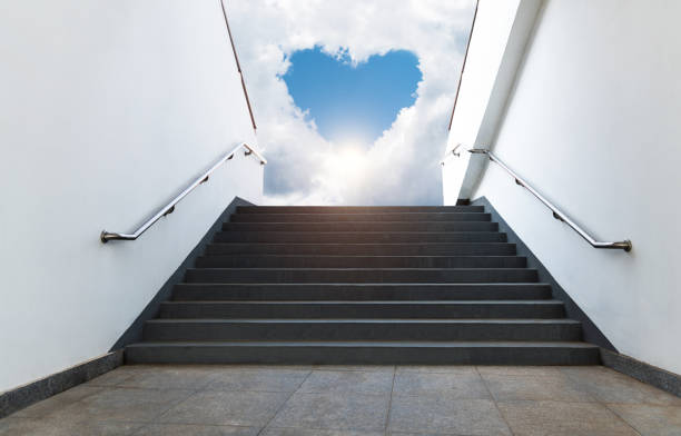 istock Empty staircase leading to heart shape sky 1442789445