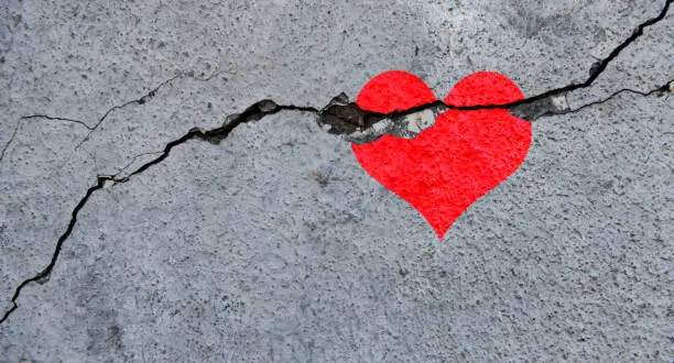 Broken heart on concrete wall