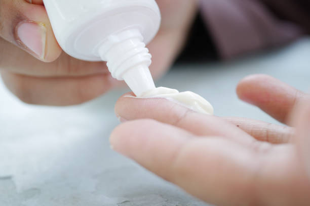 istock close up of hand using sunscreen cream 1442790439
